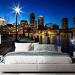 Fotótapéta Éjszakai város látképe egy víztömeggel