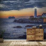 Fotótapéta Világítótorony egy sziklás parton, a háttérben egy tengerjáró hajóval