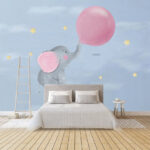 Fotótapéta Rajzfilm egy léggömböt tartó elefántról